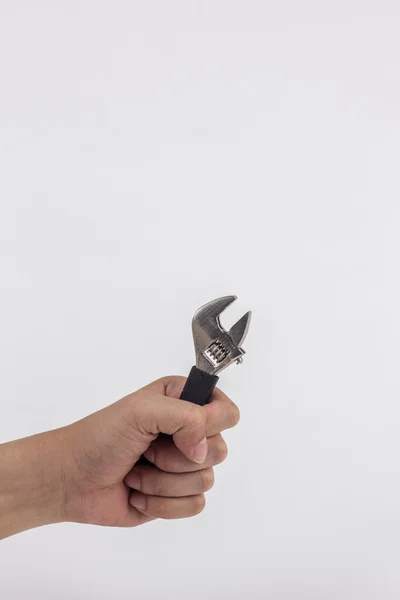 Hand holding adjustable wrench isolated — Stock Photo, Image
