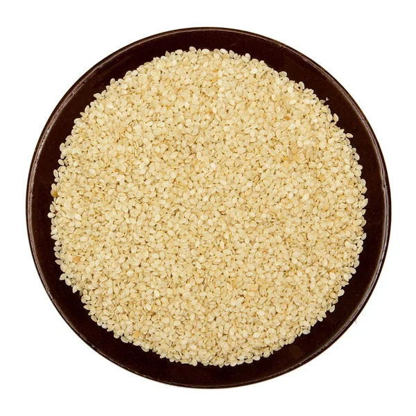 Sesame seeds in brown plate — Stock Photo, Image