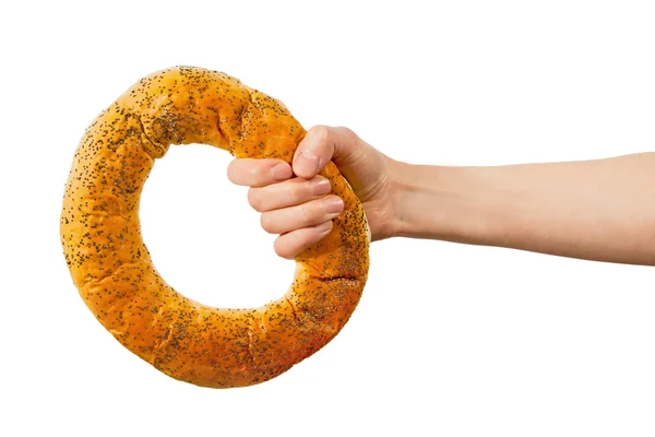 Hand som håller ring bröd — Stockfoto