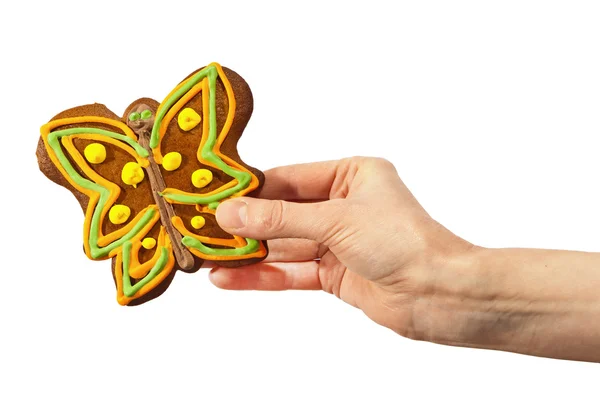 Gingerbread butterfly in hand — Stock Photo, Image