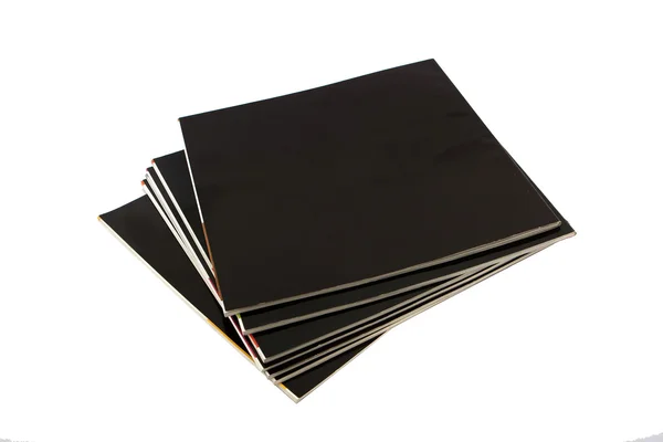 Stack of black covered magazines — Stock Photo, Image