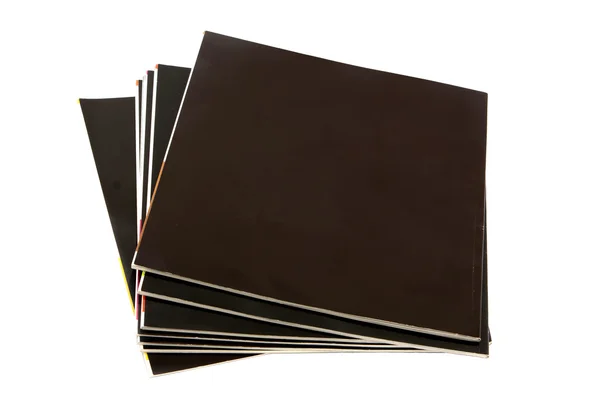 Stack of black covered magazines — Stock Photo, Image