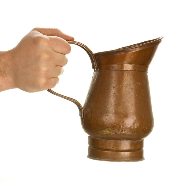 Hand som håller tenn jug — Stockfoto