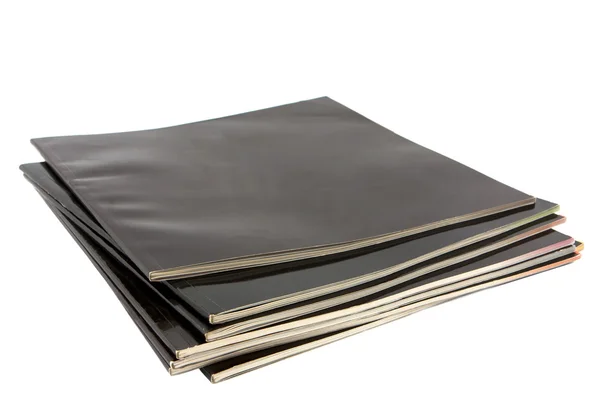 Pila di riviste coperte di nero — Foto Stock