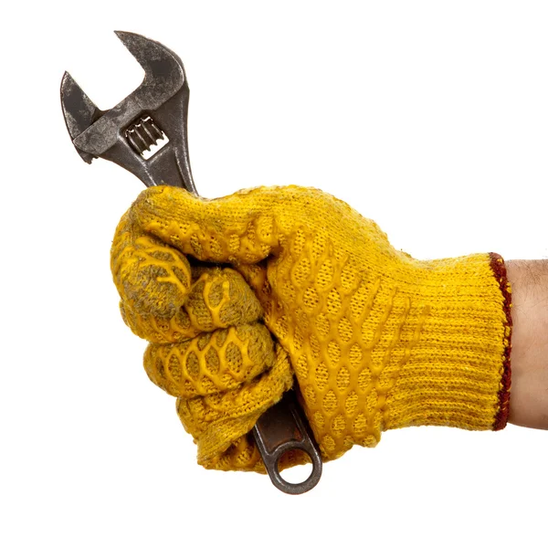 Adjustable wrench in hand with glove — Stock Photo, Image