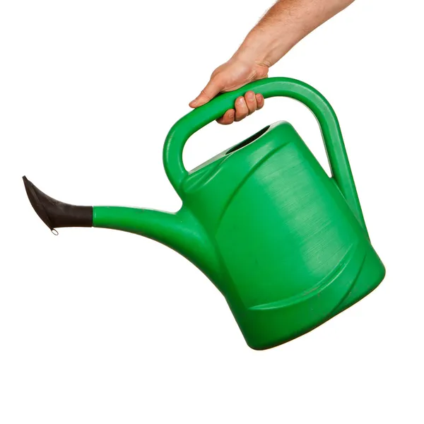Hand holding plastic watering can — Stock Photo, Image