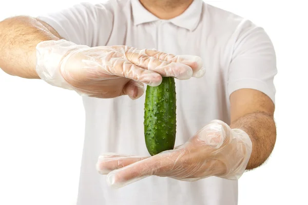 Man in white shirt holding cucumber — Stock Photo, Image