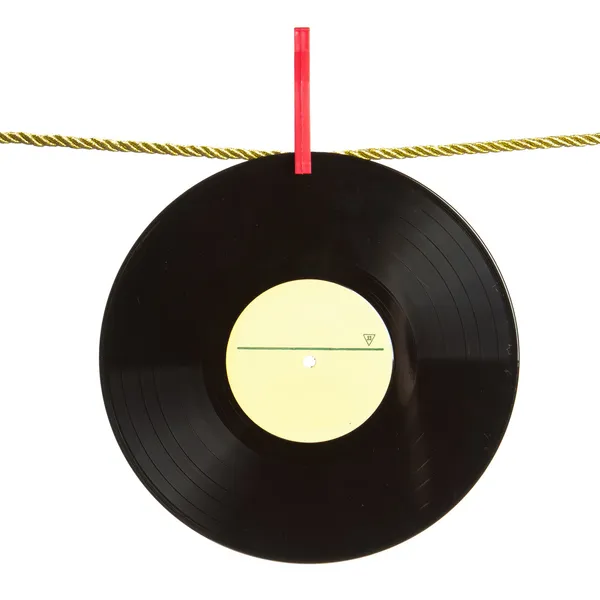 Vinyl record op goud koord — Stockfoto