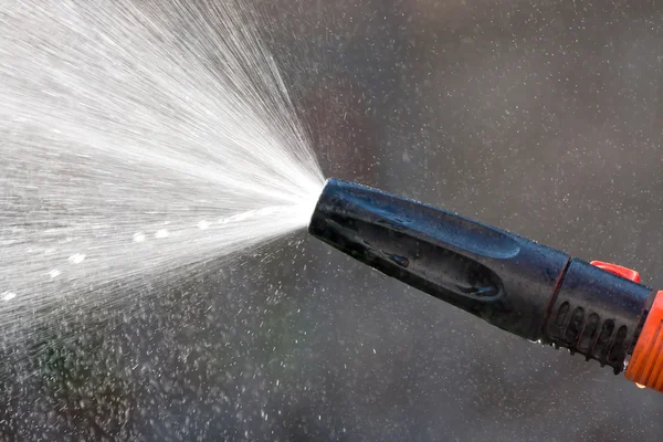 Water from a garden hose — Stock Photo, Image