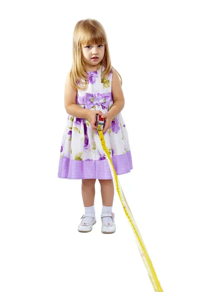 Little girl with measuring tape — Stock Photo, Image