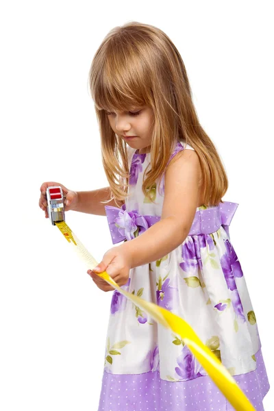 Little girl with measuring tape — Stock Photo, Image