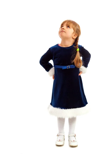 Little girl in dark blue dress looking up — Stock Photo, Image