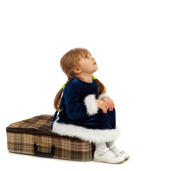 Little girl sitting on big travel suitcase — Stock Photo, Image