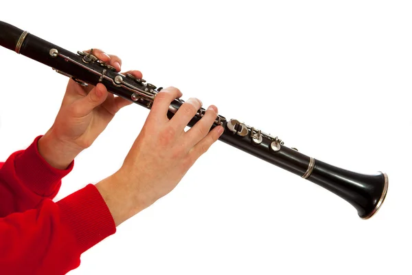 Hands playing on clarinet. Isolated over white background — Stock Photo, Image