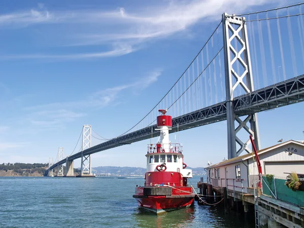 San Francisco Bay Bridge with a red ship — Stock Photo, Image