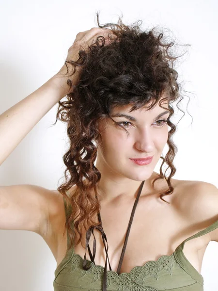 Young woman in green dress posing — Stock Photo, Image