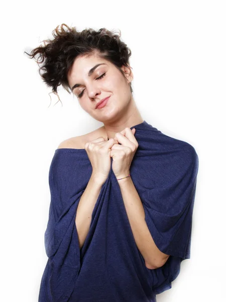 Young woman in blue t-shirt hugging herself — Stock Photo, Image