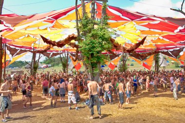OZORA, HUNGARY - AUGUST 01: People dancing on Ozora Festival, on clipart