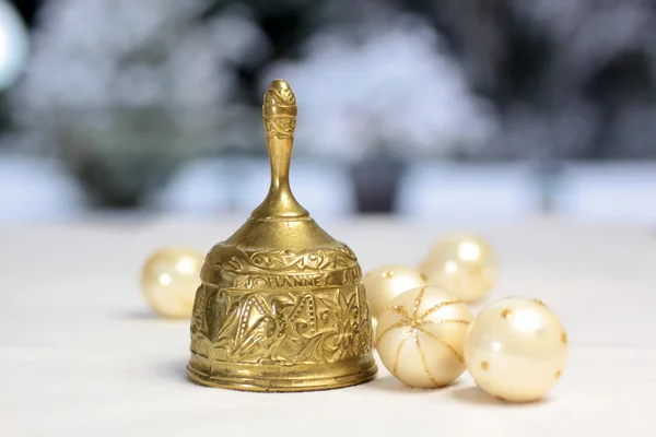 Golden Christmas bell and Christmas balls — Stock Photo, Image
