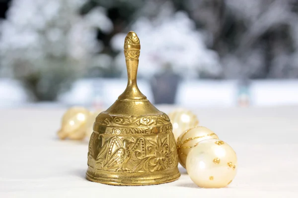 Golden Christmas bell and Christmas balls — Stock Photo, Image