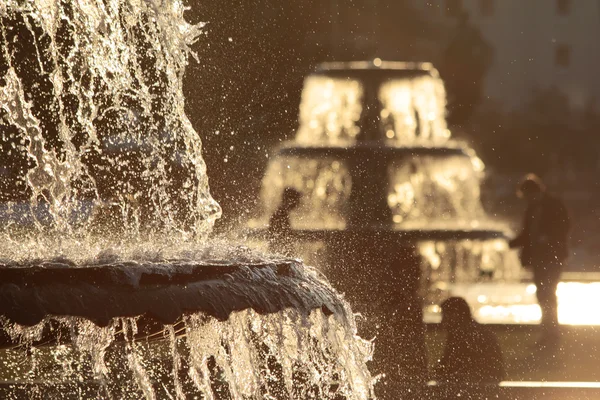 Fountains in back light — Stock Photo, Image