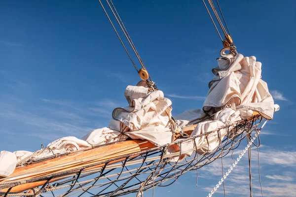 Gathered sail of a big sailing ship — Stock Photo, Image