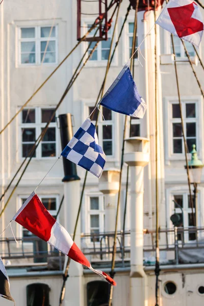 Colorful flags on old sailing boat — Stock Photo, Image