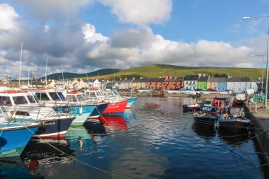Colorful boats in the port of Portmagee clipart