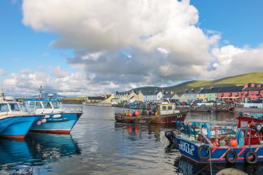 Colorful boats in the port of Portmagee clipart