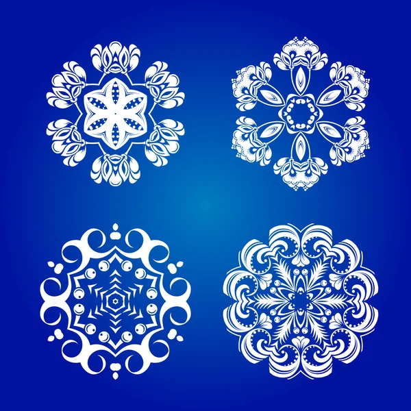 Flocons de neige isolés sur fond bleu — Image vectorielle