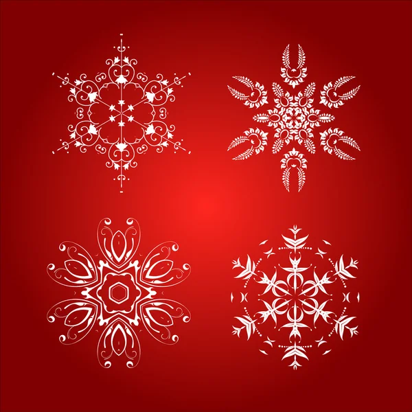 Flocons de neige isolés sur fond rouge — Image vectorielle