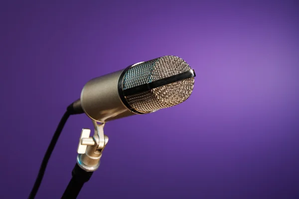 Metallic microphone on purple — Stock Photo, Image