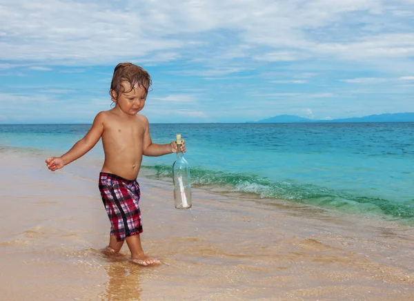 Toddler holding sos bottle — Stock Photo, Image