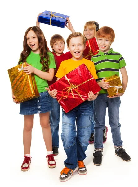 Niños y niñas con regalos de Navidad Imagen De Stock