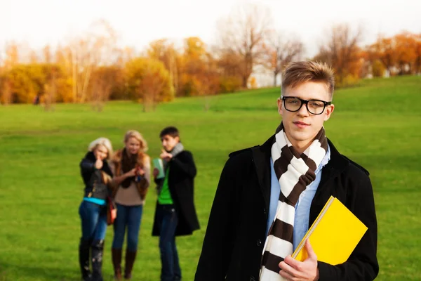 Smart student with friends — Stock Photo, Image