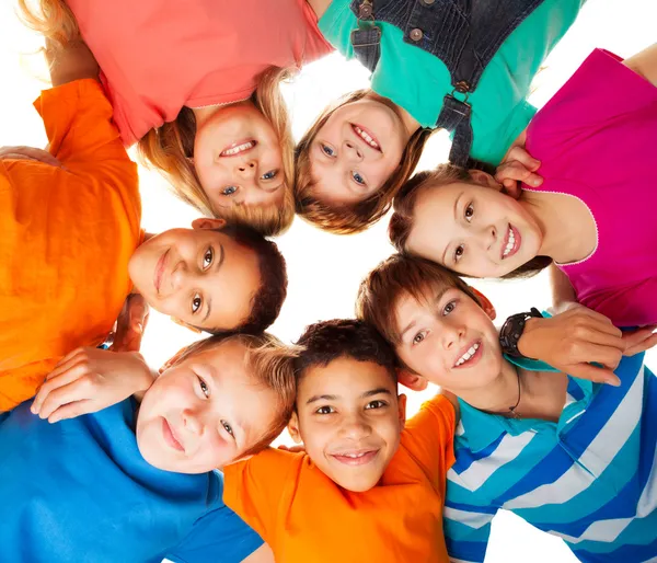 Circle of happy kids together smiling — Stock Photo, Image