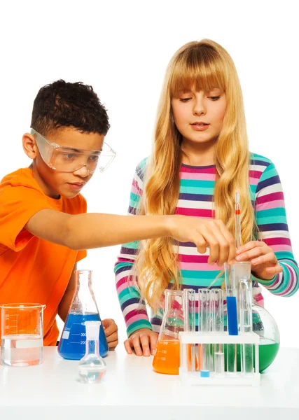 Couple kids in science lab Royalty Free Stock Photos