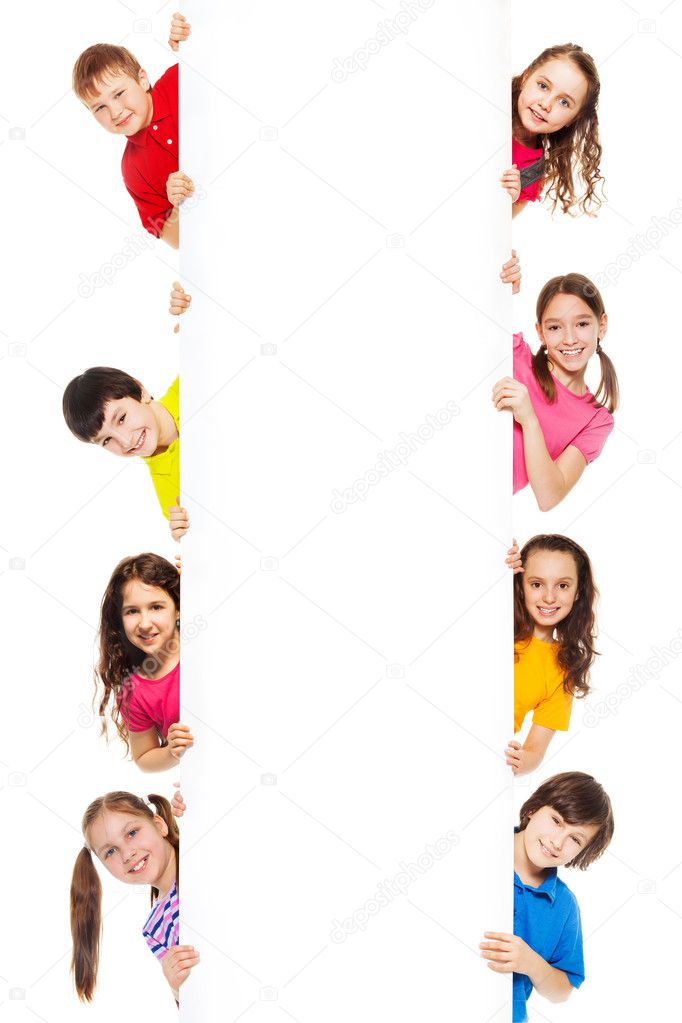Six kids looking from blank billboard
