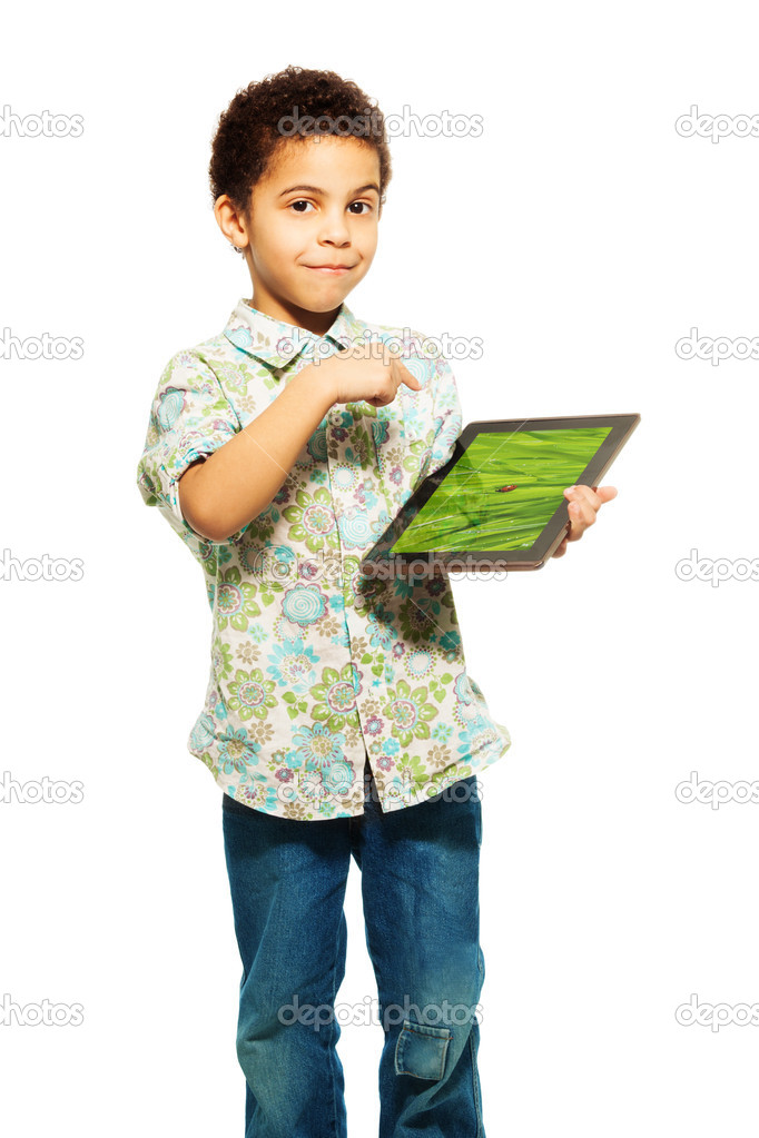 Black boy shows photo on tablet computer