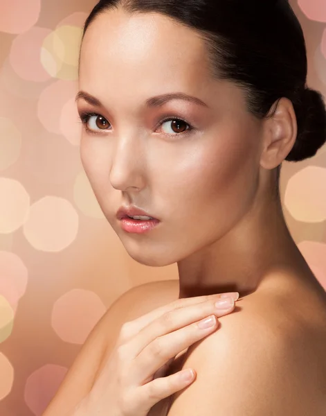 Beauty Asian woman on caramel background — Stock Photo, Image