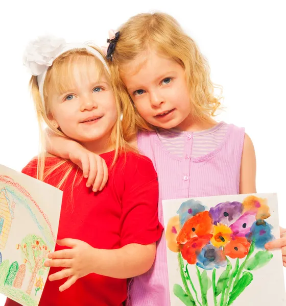 Two blond girls with their paintings — Stock Photo, Image