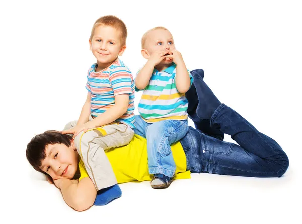 Two younger brothers ride big one — Stock Photo, Image