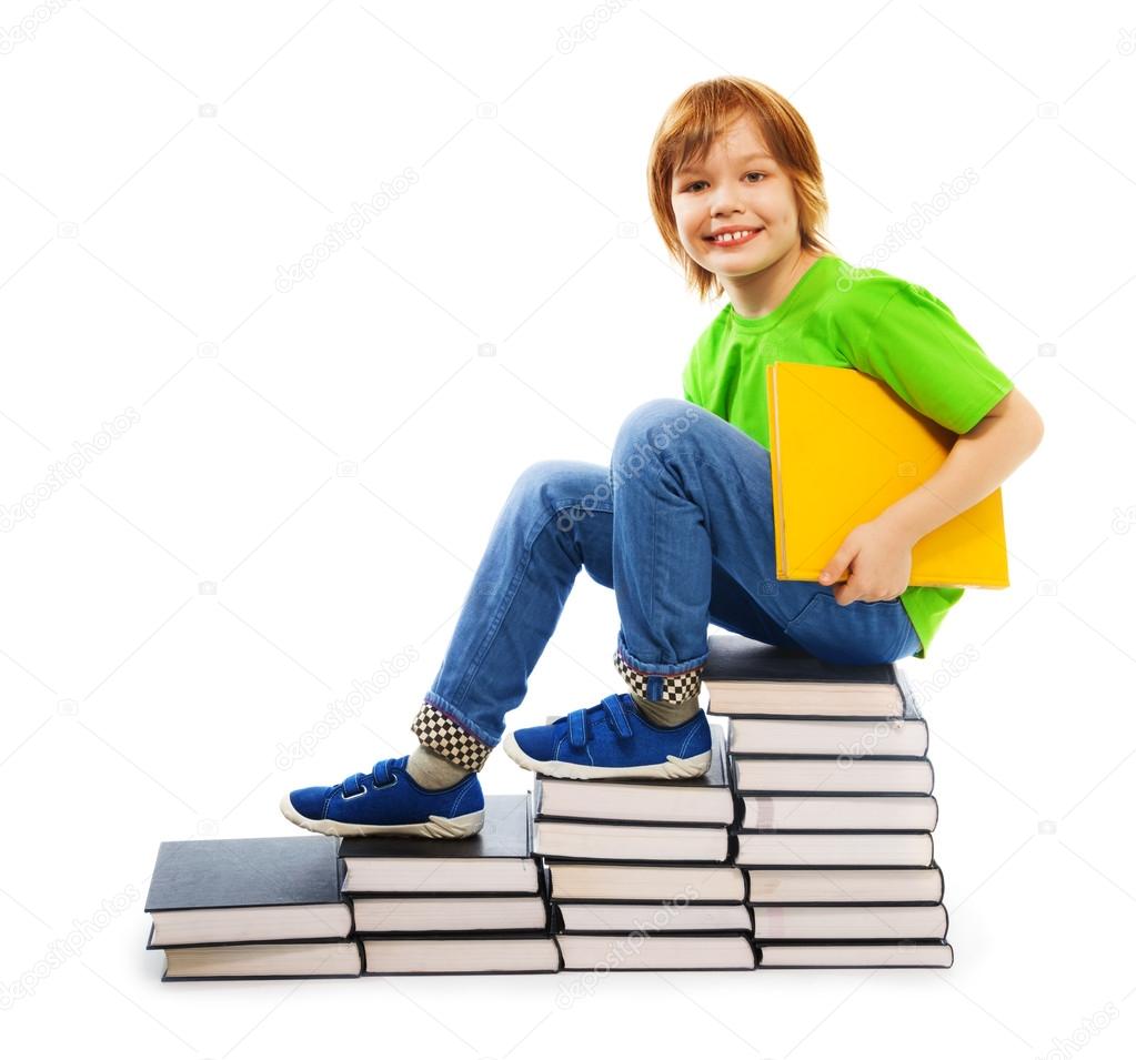 Clever boy on pile of books