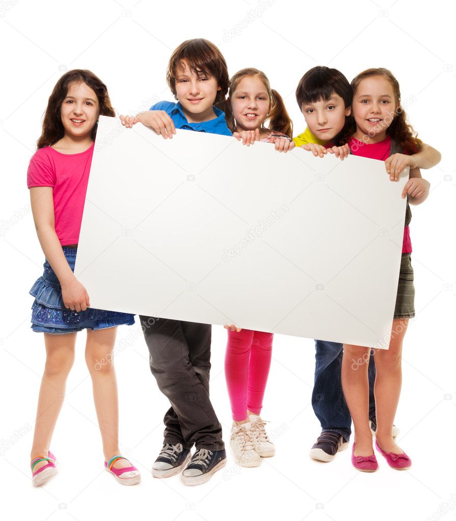 Group of schoolchildren holding white board