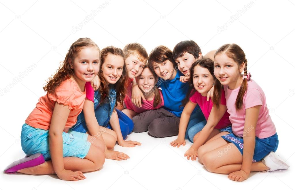 Boys and girls sitting together in semi-circle