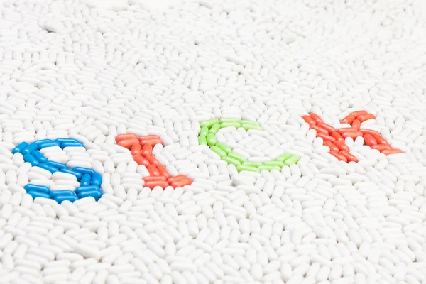 Sick text word made of pills — Stock Photo, Image