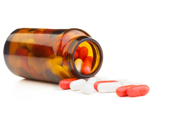 Drug pills and medicine jar — Stock Photo, Image