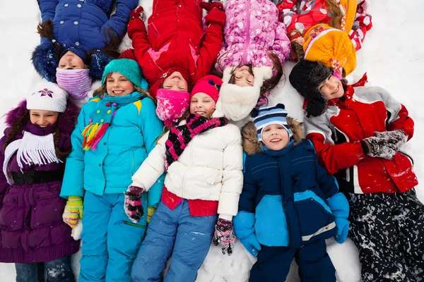 Many kids in snow — Stock Photo, Image