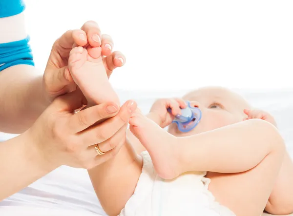 Massaging baby foot — Stock Photo, Image