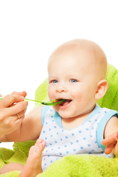 Feeding baby from spoon — Stock Photo, Image